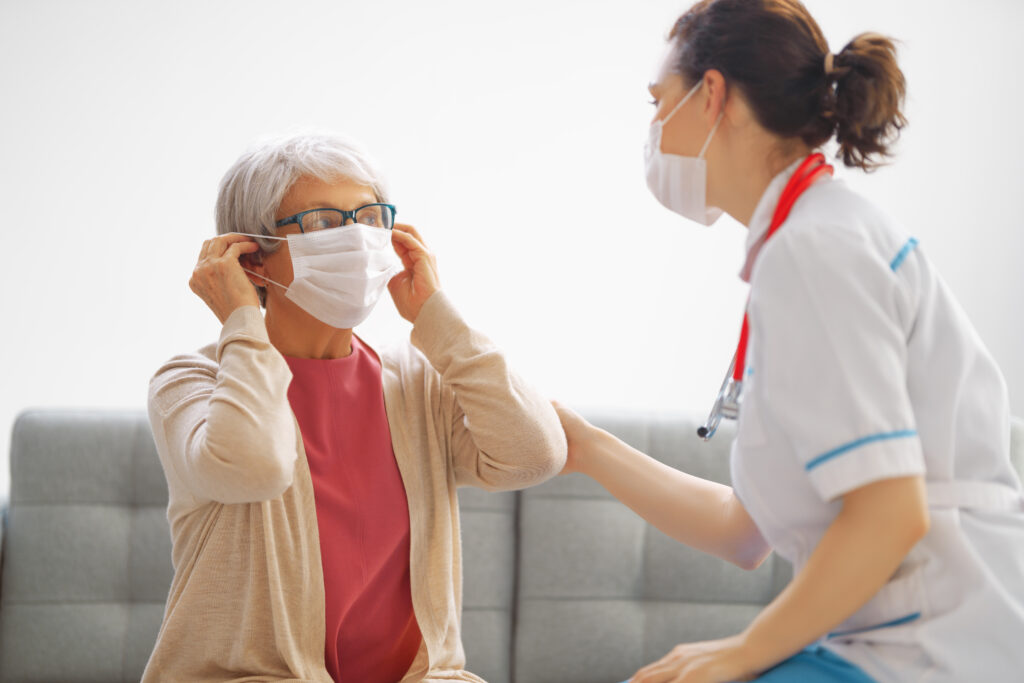 Caregiver assisting senior with medication